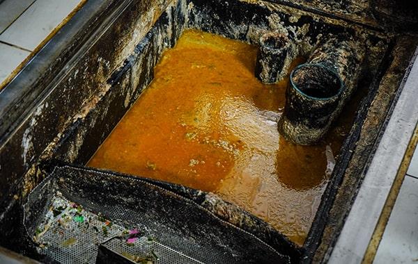 neglecting grease trap cleaning can result in clogs, foul odors, and even sewage backups